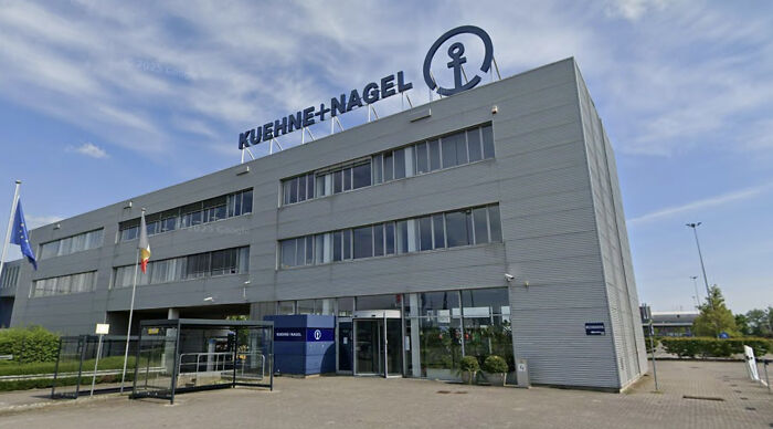 Modern office building exterior under blue sky, symbolizing health cuts reshaping women&rsquo;s reproductive rights in the U.S. and abroad.