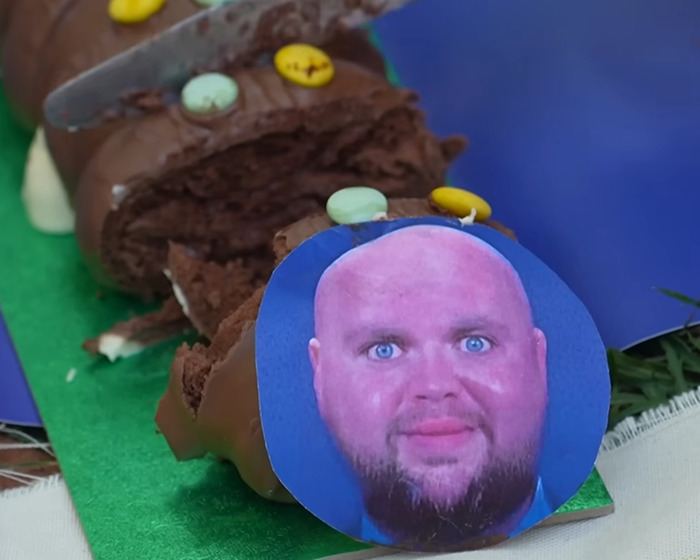 Chocolate cake designed as a convoy with a photo of D Vance, illustrating villagers&rsquo; fury over disabled parking incident.