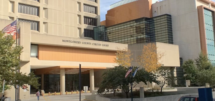 Montgomery County Circuit Court building exterior with flags and trees, related to mother allegedly taking lives of children.