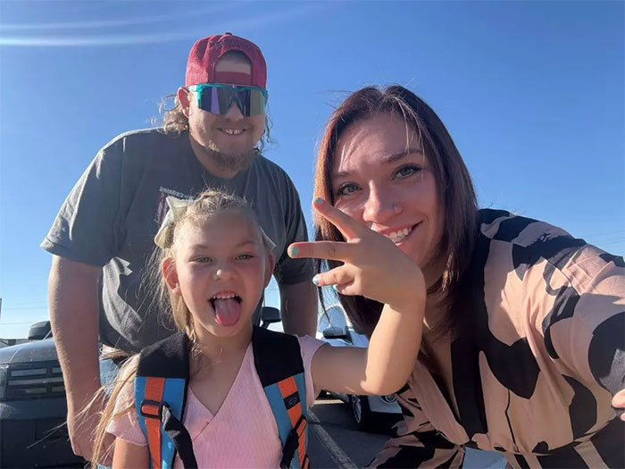 Family smiling outdoors with young girl, related to Utah hospital botched baby delivery and judge award keywords.