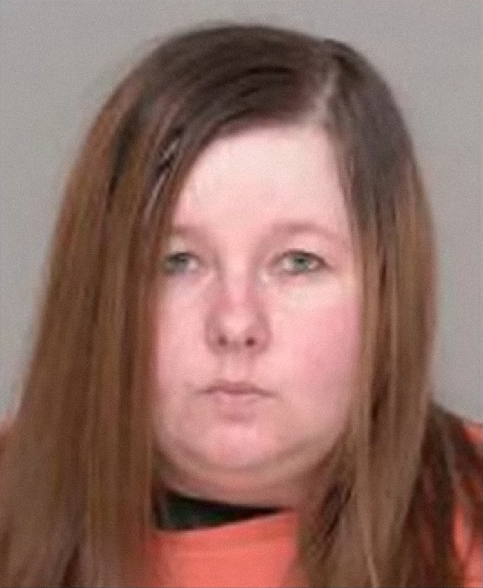 Woman arrested for draining son's blood to fake illness and brutalizing kids, facing long prison term in custody photo.