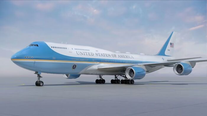 Air Force One parked on runway under cloudy sky with Spirit Airlines planes scolded for flying too close.