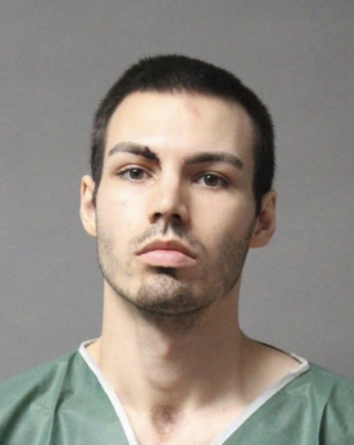 Young man in green shirt with short dark hair and facial injuries, related to New Hampshire country club shooting victim.