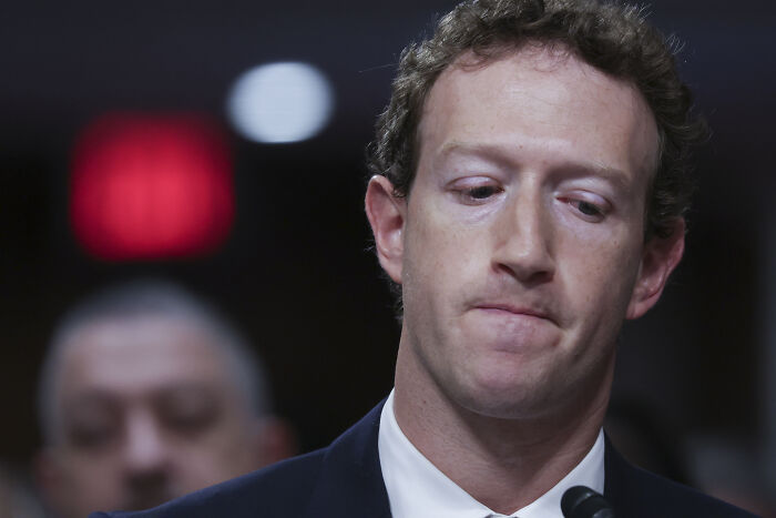 Mark Zuckerberg with a serious expression during a hearing, representing social media impact on Donald Trump.