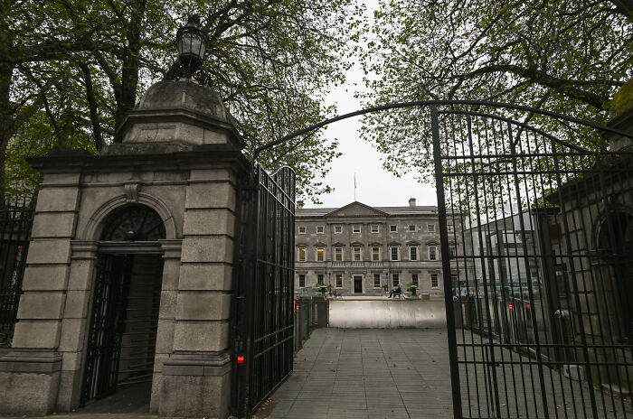 Entrance gate to an official Irish government building, relevant to Conor McGregor&rsquo;s Irish presidency bid challenges.