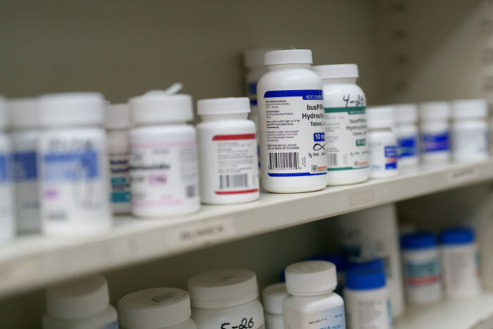 Pharmaceutical bottles lined up on shelves representing products impacted by new tariffs on pharmaceutical imports.