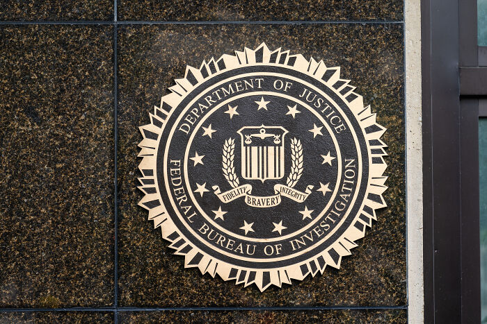 FBI seal mounted on a building wall representing the federal investigation related to Tom Homan's cash sting.