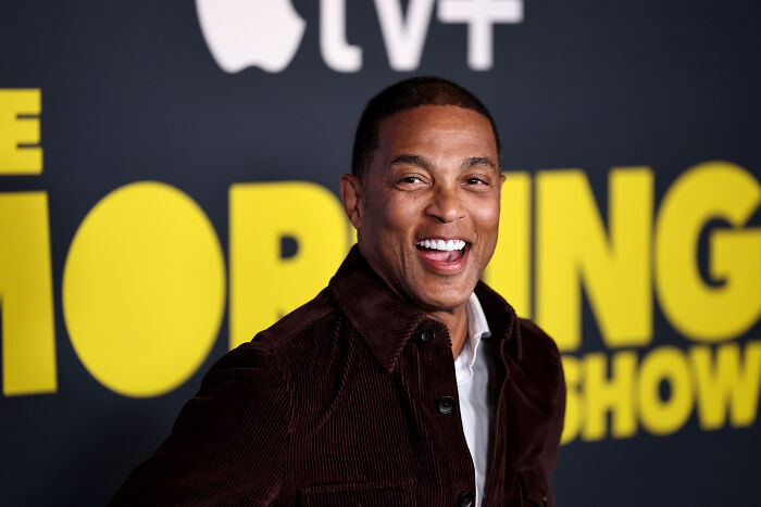 Man smiling at an event background featuring the morning show logo, related to Don Lemon and viral video keywords.