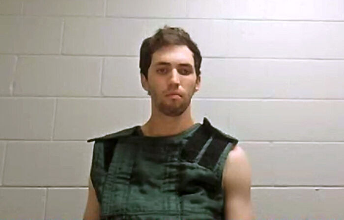 Young man wearing a protective vest during a news interview related to ABC News reporter and Tyler Robinson texts controversy.