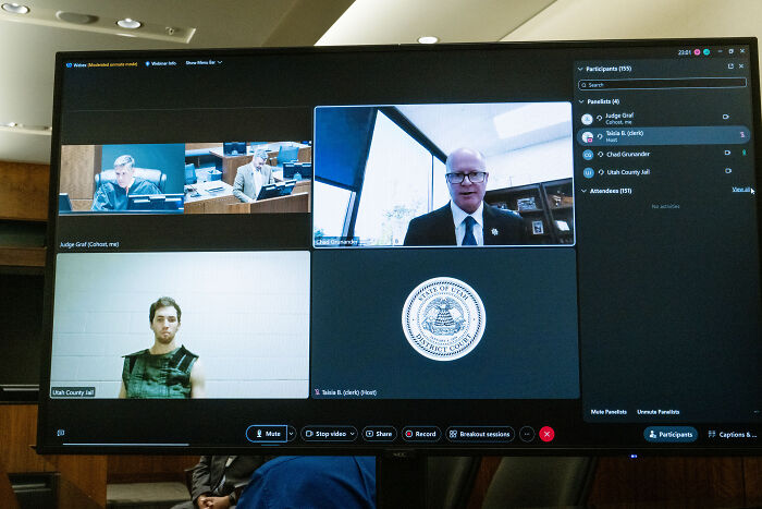 Virtual court hearing screen showing multiple participants including judge and Utah County Jail with ABC news reporter coverage related to Tyler Robinson texts.