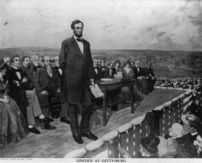 Abraham Lincoln speaking at Gettysburg, a key moment linked to American presidents who waged war.