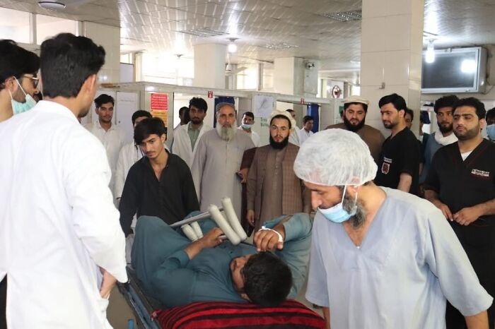 Rescue teams attend to injured survivors inside a hospital after Afghanistan earthquake causes widespread casualties.