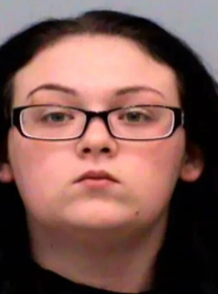 Mugshot of a woman with glasses and dark hair related to a dad guilty of manslaughter after giving baby Benadryl.
