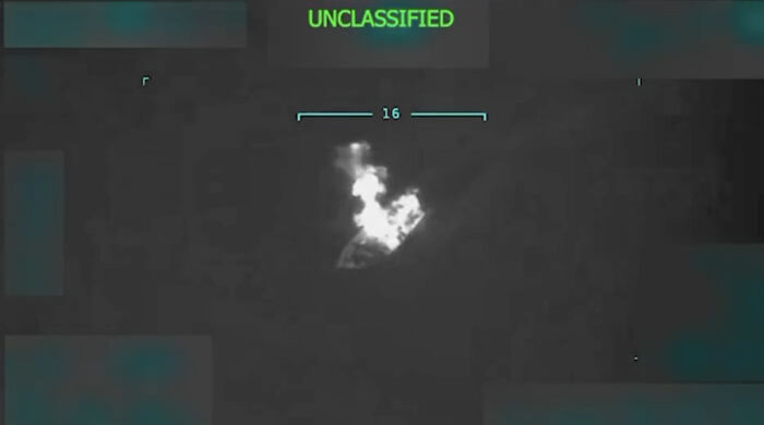 Thermal image showing an explosion at night marked unclassified, related to Trump starting war with Venezuela concerns.
