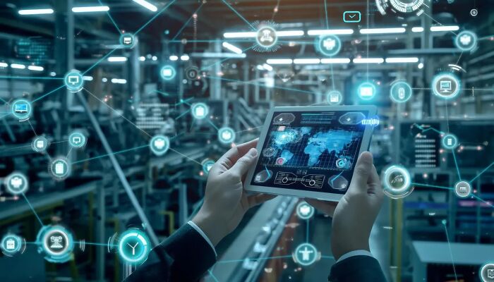 Hands holding a digital tablet displaying a network map in a high-tech environment illustrating secret digital network activity.