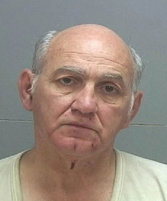 Mugshot of an older man identified as the gadfly who lied about shooting Charlie Kirk, caught with disturbing files by police.