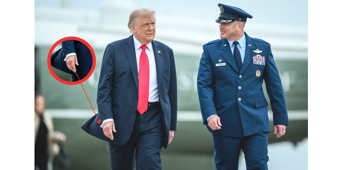 Donald Trump walking with aide, Melania&rsquo;s hand strategically placed to conceal injury during UK arrival.