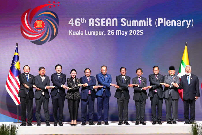 Group of leaders at the 46th ASEAN Summit in Kuala Lumpur highlighting the impact of Trumps trade war costing billions globally.
