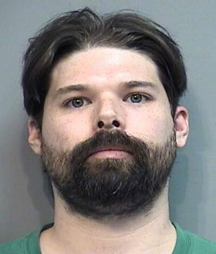 Mugshot of a man with dark hair and beard, linked to helping bury kids of former Walmart Santa in Georgia yard.