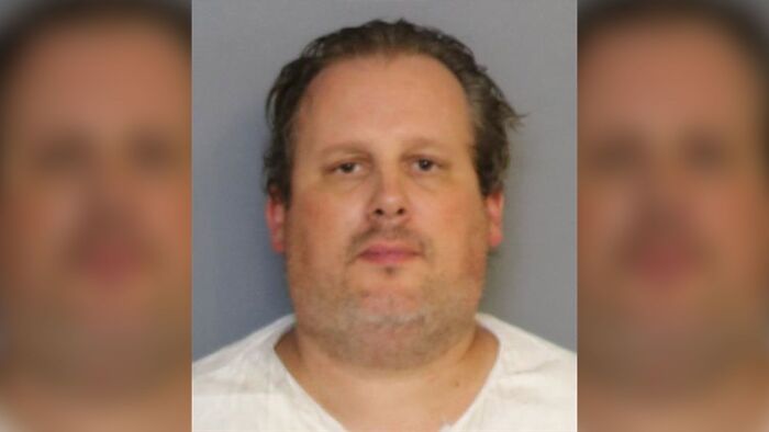 Mugshot of a Florida man involved in a case where he unalived his wife, children, and dog, then lived with their bodies.