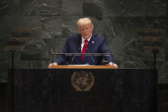 Speaker at the United Nations podium addressing the White House East Wing demolition uproar and criticism.