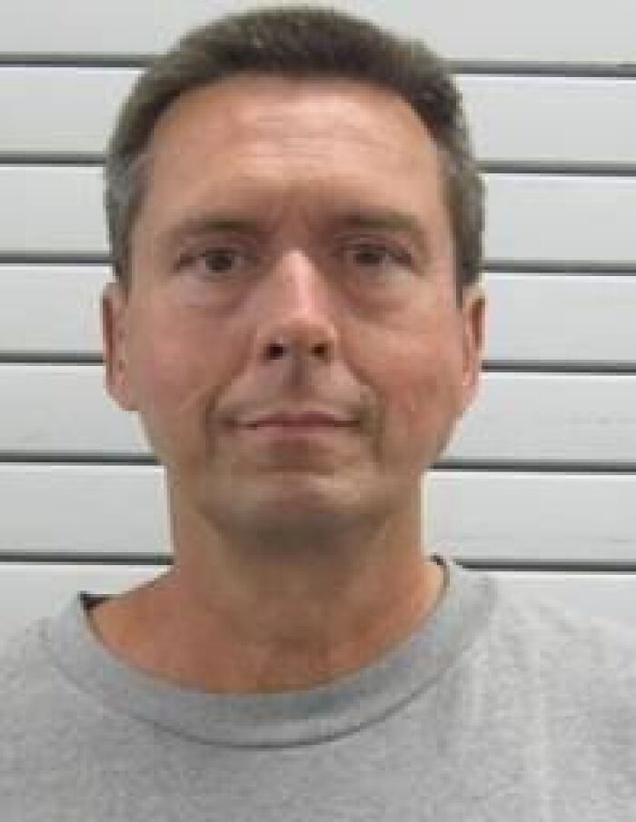 Mugshot of violent inmate involved in case related to school teacher and exploitation of 15-year-old girl.