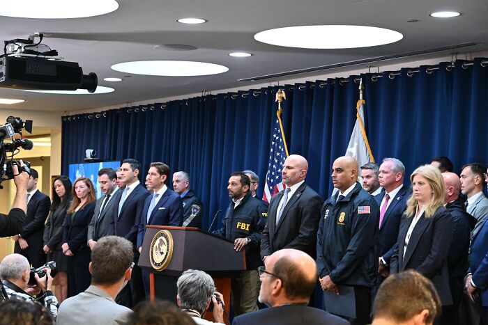 FBI officials and law enforcement at a press conference addressing NBA gambling cases involving mafia money and insider bets.