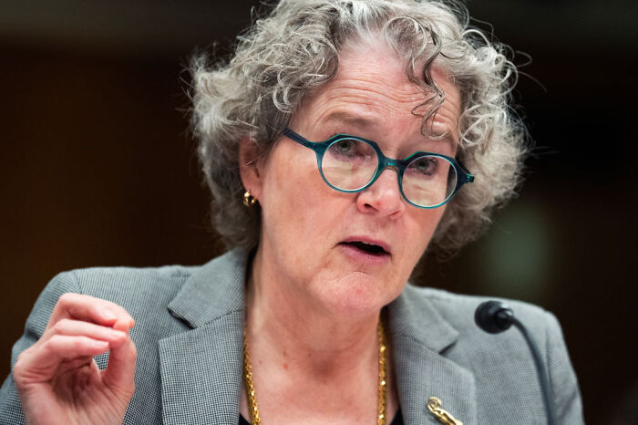 Senior infectious disease official speaking at a hearing, highlighting RFK Jr. actions following whistleblower filing concerns.