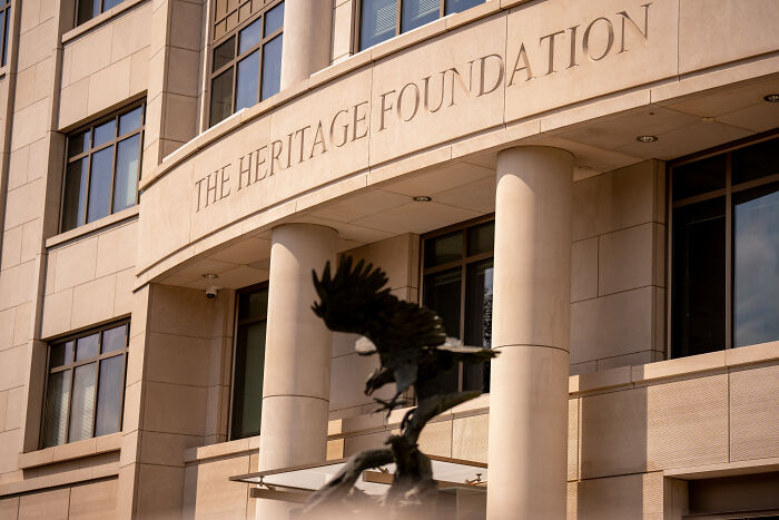 The Heritage Foundation building exterior with eagle statue representing Trump meeting Russ Vought Project 2025 political discussion