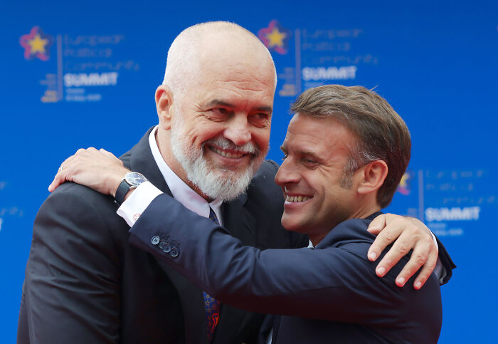 Two European leaders warmly embracing at a summit, capturing a moment linked to Donald Trump geographic gaffe mockery.