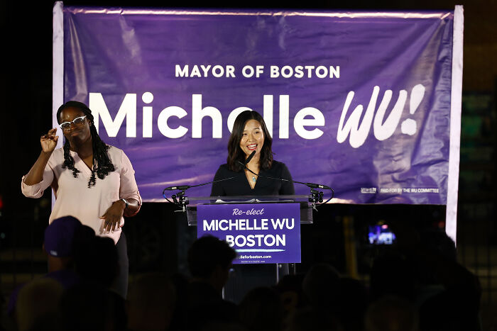 Boston mayor Michelle Wu speaking at a rally, addressing Trump's threat to pull World Cup games from the city.