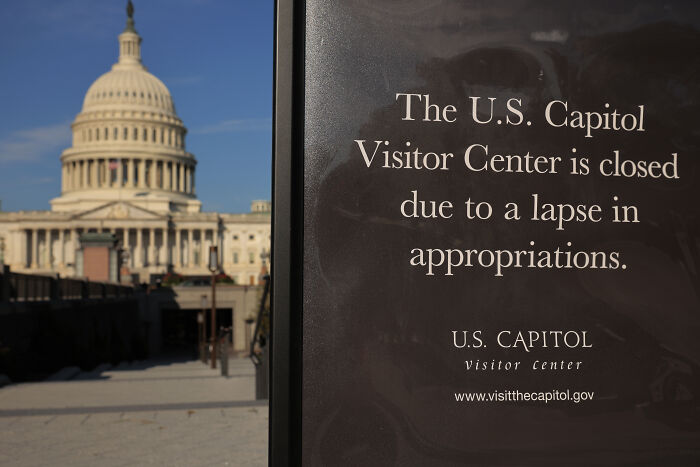 Sign at U.S. Capitol visitor center states closure due to government shutdown amid calls to scrap Senate filibuster.