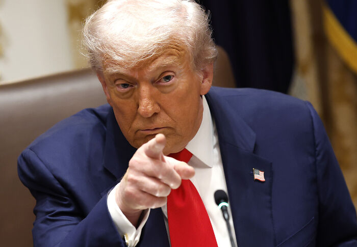 Donald Trump pointing forward during a meeting, highlighting tensions in his latest private shouting match with Zelenskyy.