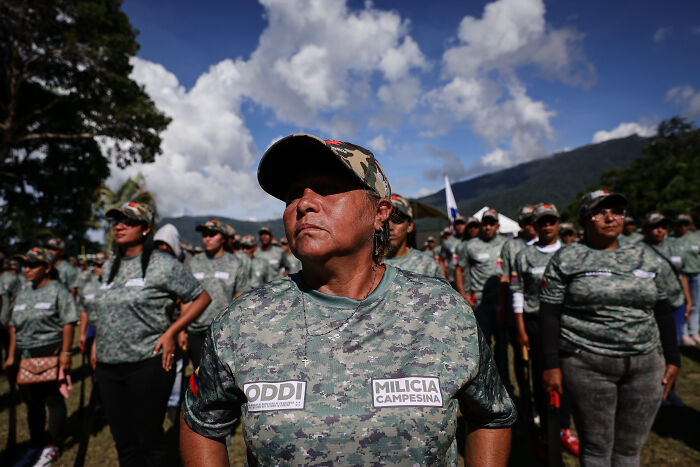 Venezuelan militia members in camouflage uniforms standing outdoors amid rising tensions with the U.S.