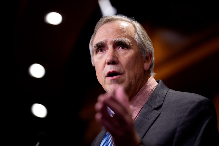 A senator delivering a lengthy floor speech warning of Trump&rsquo;s authoritarian takeover in a formal setting.