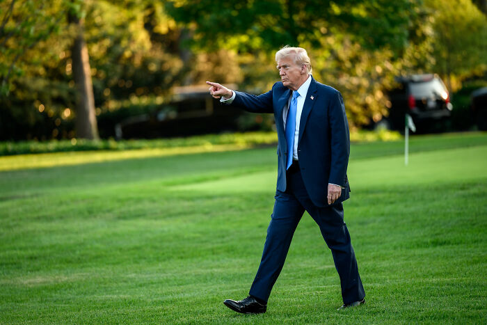 Donald Trump walking on grass, pointing forward, related to JD Vance and Trump&rsquo;s ABC nemesis conflict.