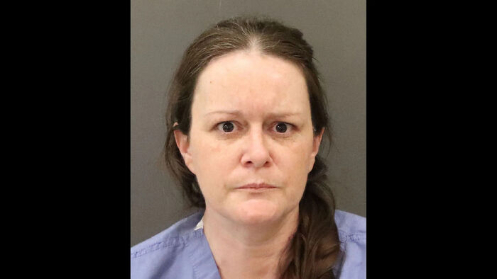 Mugshot of a woman involved in a case where she sedated her son until he passed out before a tragic incident.