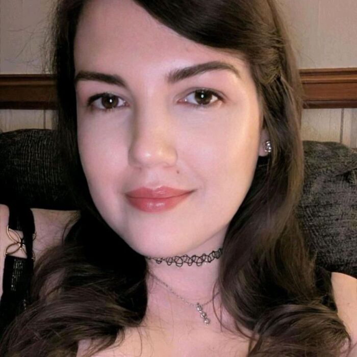 Close-up of a young woman with brown hair and brown eyes related to man arrested over homicide of British woman in the U.S.