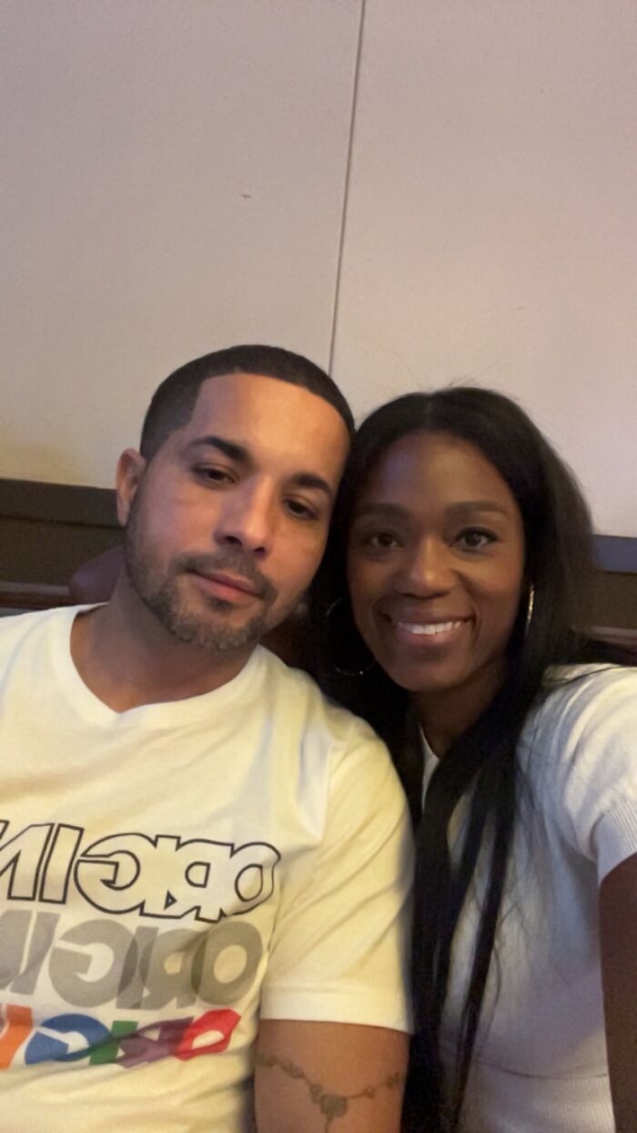 Man and woman smiling together indoors, representing hero Navy sailor shortly before drowning.