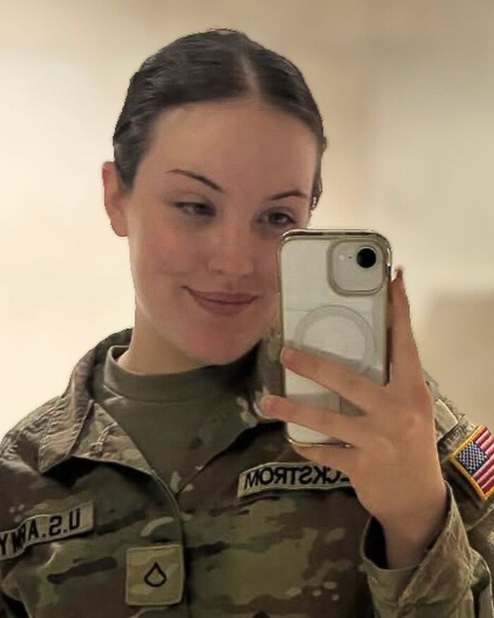 National Guard member in uniform taking a selfie, related to D.C. shooting and prosecutorial death penalty vow.
