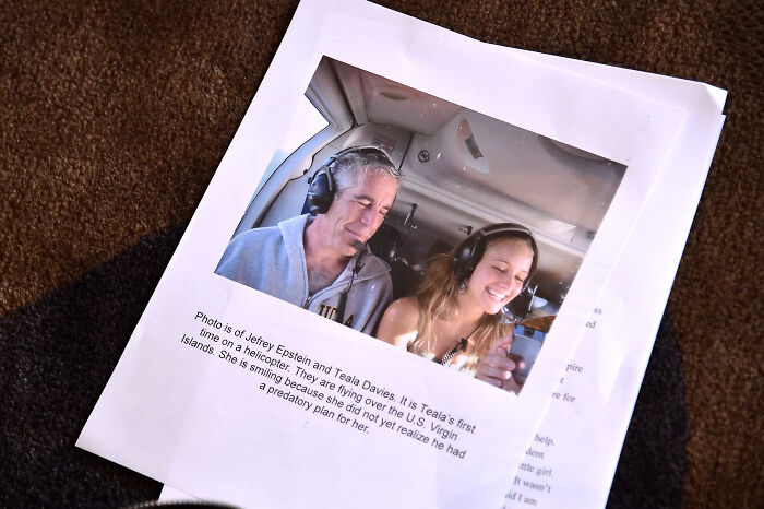 Printed photo showing Jeffrey Epstein and Teala Davies on a helicopter, related to Christina Ricci slamming Megyn Kelly over Epstein comments.