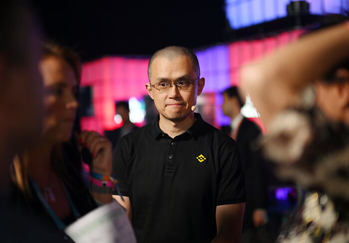 Man in glasses and a black shirt at an event, illustrating 60 Minutes struggles to get on-camera guests for interviews.
