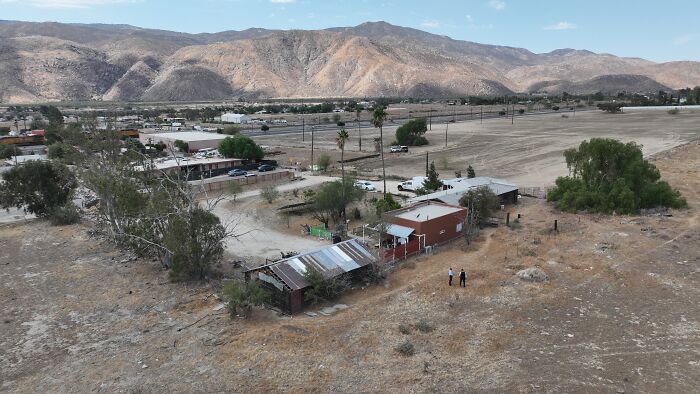 Aerial view of a rural area with dry landscape and buildings related to Jake Haro case involving baby Emmanuel.