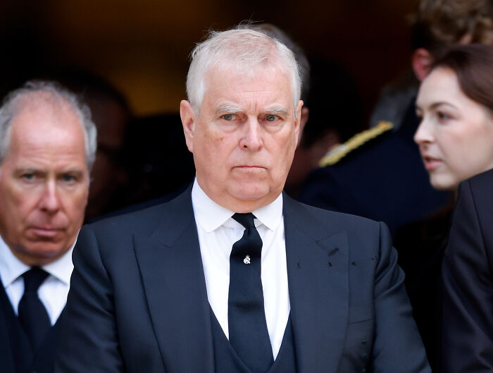 Former Prince Andrew in a black suit and tie attending an event amid U.S. Congress summons over Jeffrey Epstein links.