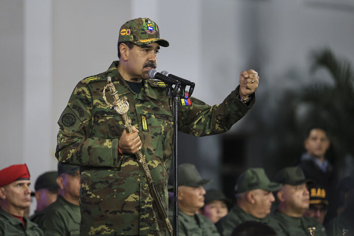 Venezuelan leader in military uniform speaking at microphone amid soldiers, related to White House Venezuela fentanyl supply crackdown.