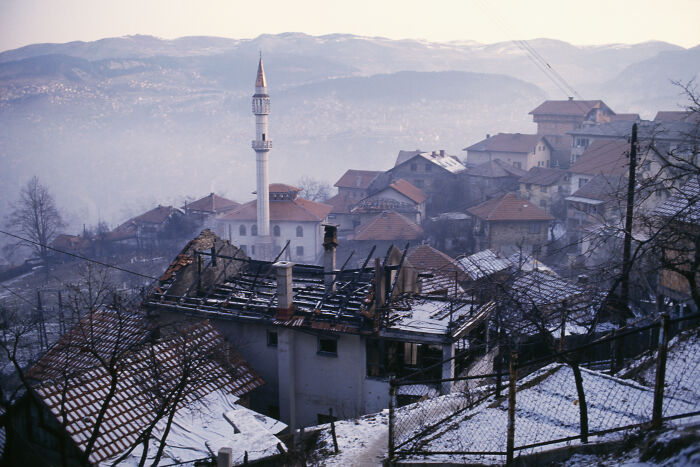 Mountain village with traditional houses and a mosque, depicting a scene linked to human safari trips investigation.