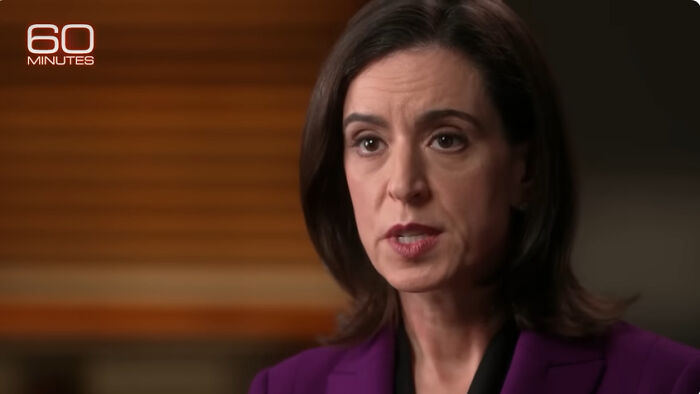 Female journalist from 60 Minutes wearing a purple blazer speaking in an indoor interview setting about on-camera guest struggles.