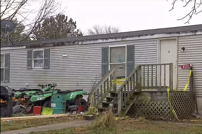 Abandoned home with caution tape outside, related to girl 14 found weighing 35 lb starved and neglected by family.