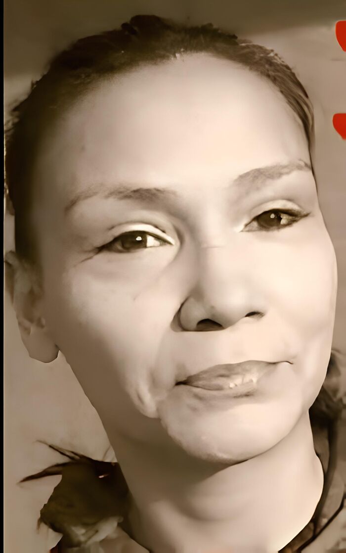 Close-up portrait of an Indigenous woman, related to the remains found after five years of a $400,000 a***e settlement.