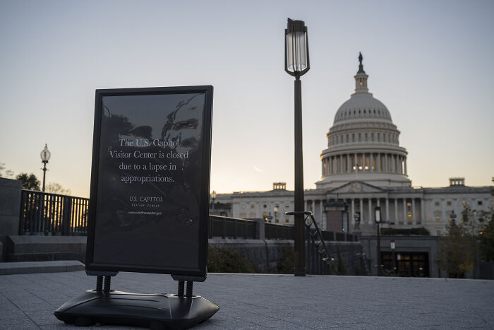 Sign near the U.S. Capitol stating the visitor center is closed during shutdown amid White House trolls Democrats dispute.